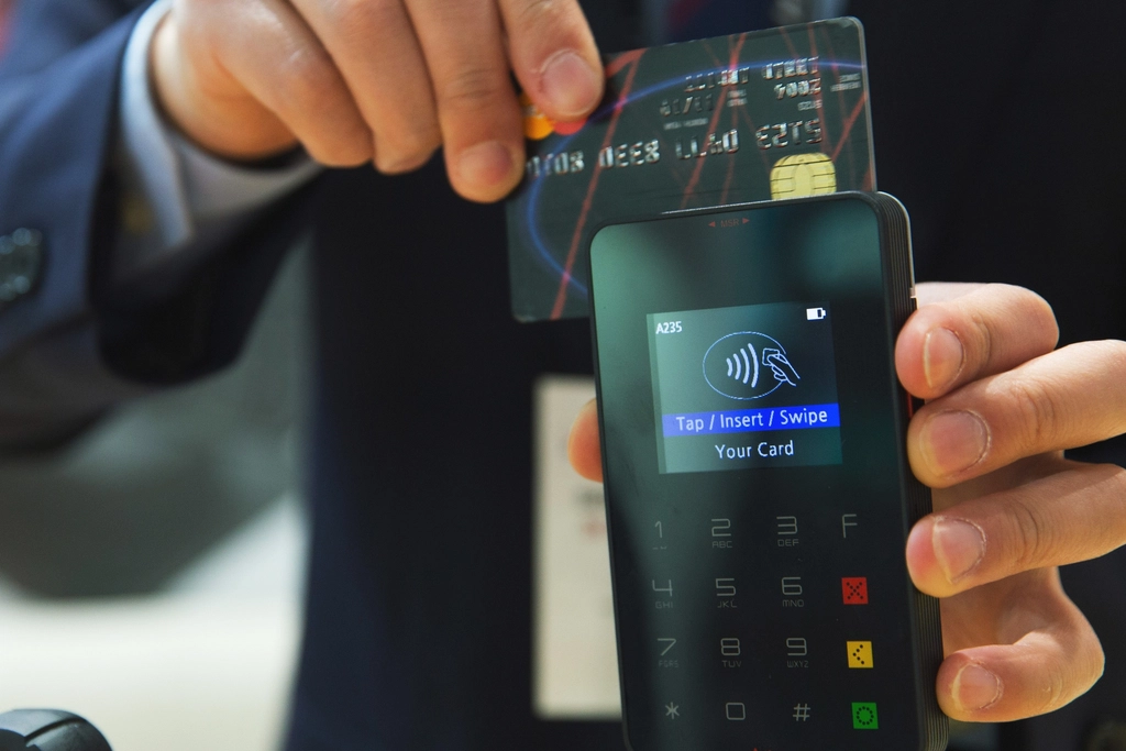 Credit cards on a table beside a receipt