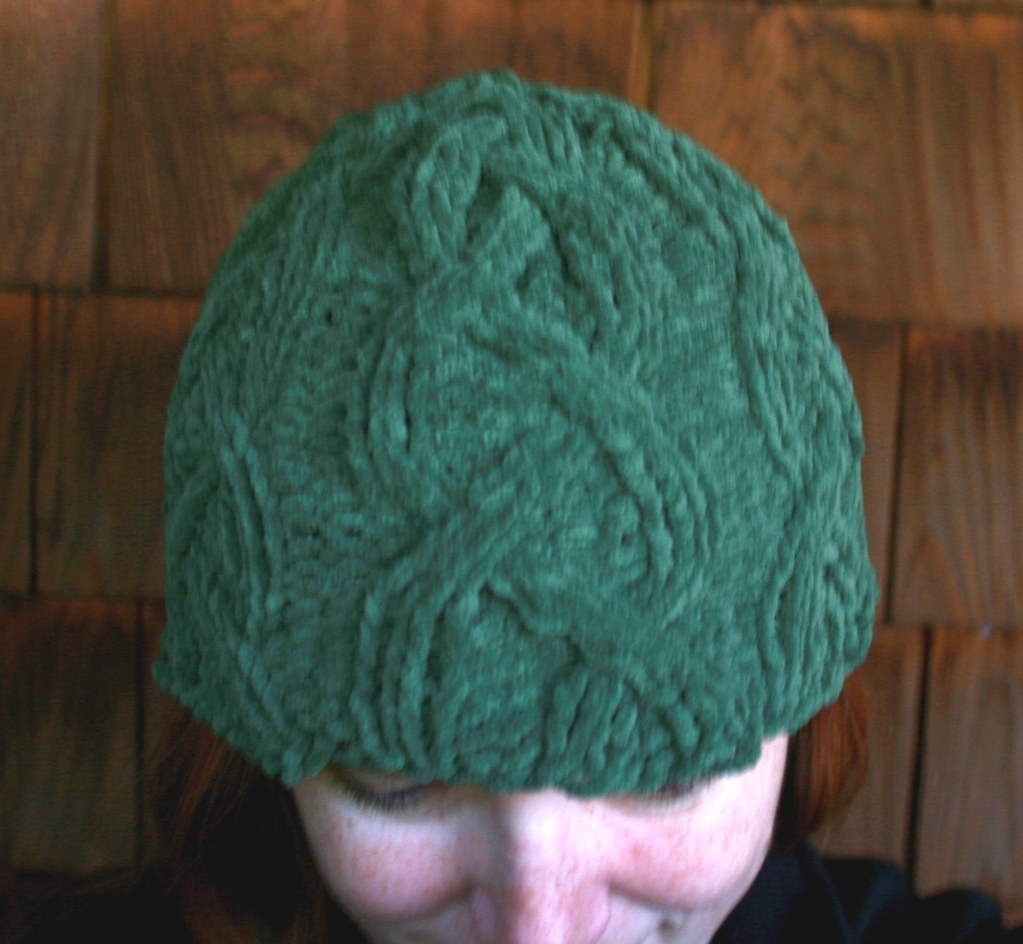 A knitted hat on a plain background
