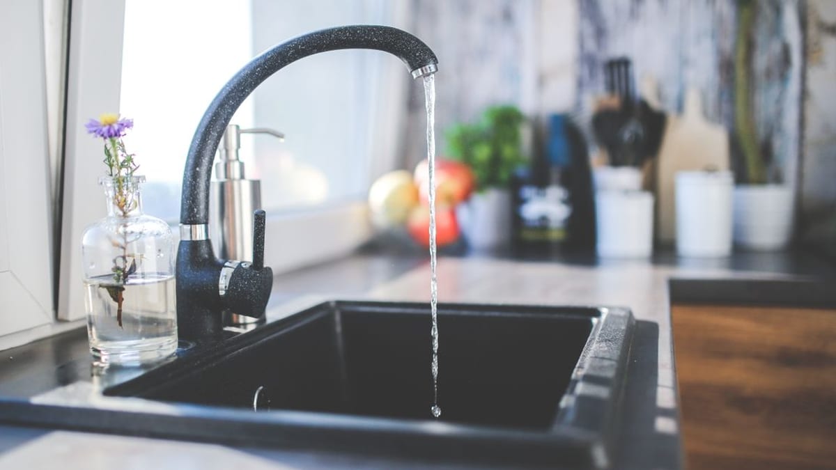 A kitchen tap running slowly