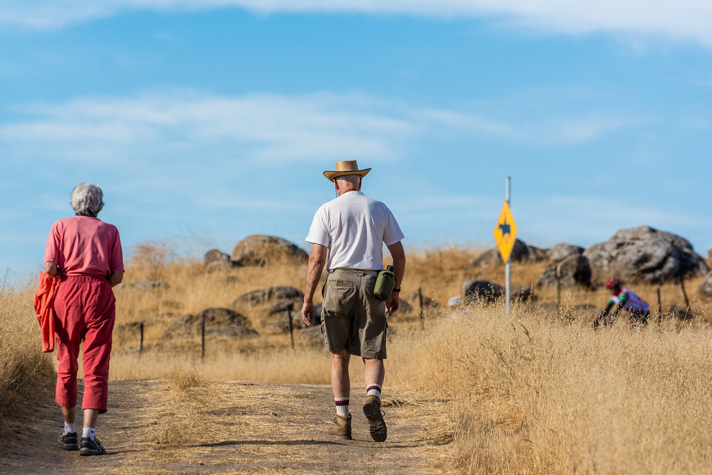 An older couple walking outdoors