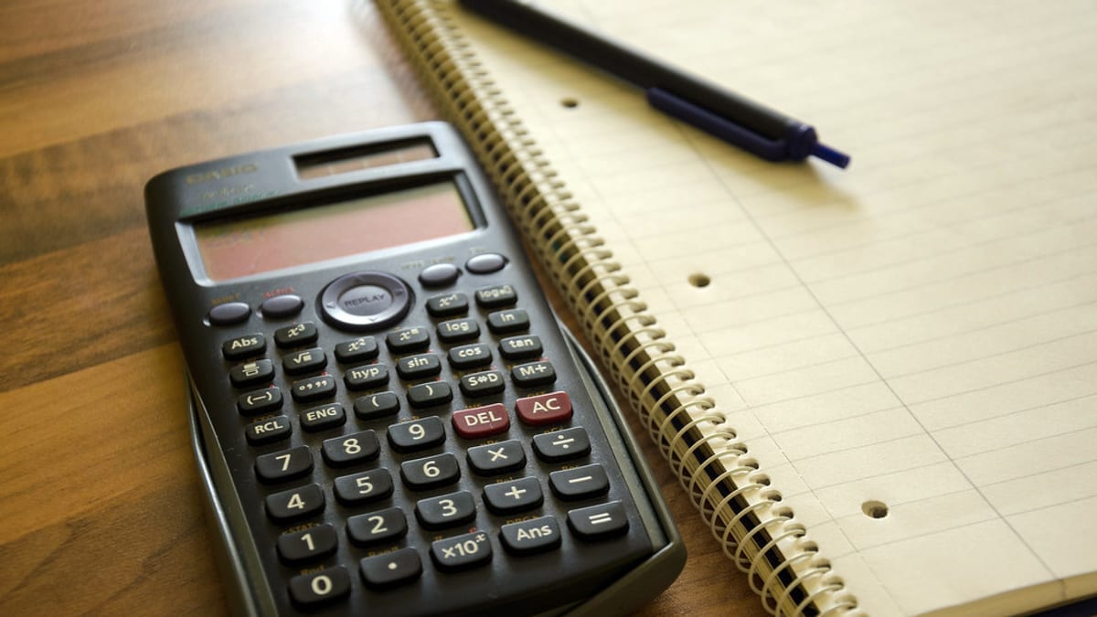 A calculator and notepad